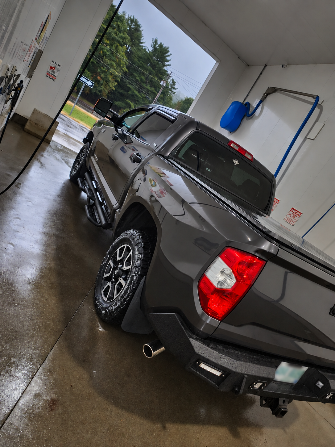 Detailed Toyota Tundra from the rear side with glossy body reflections