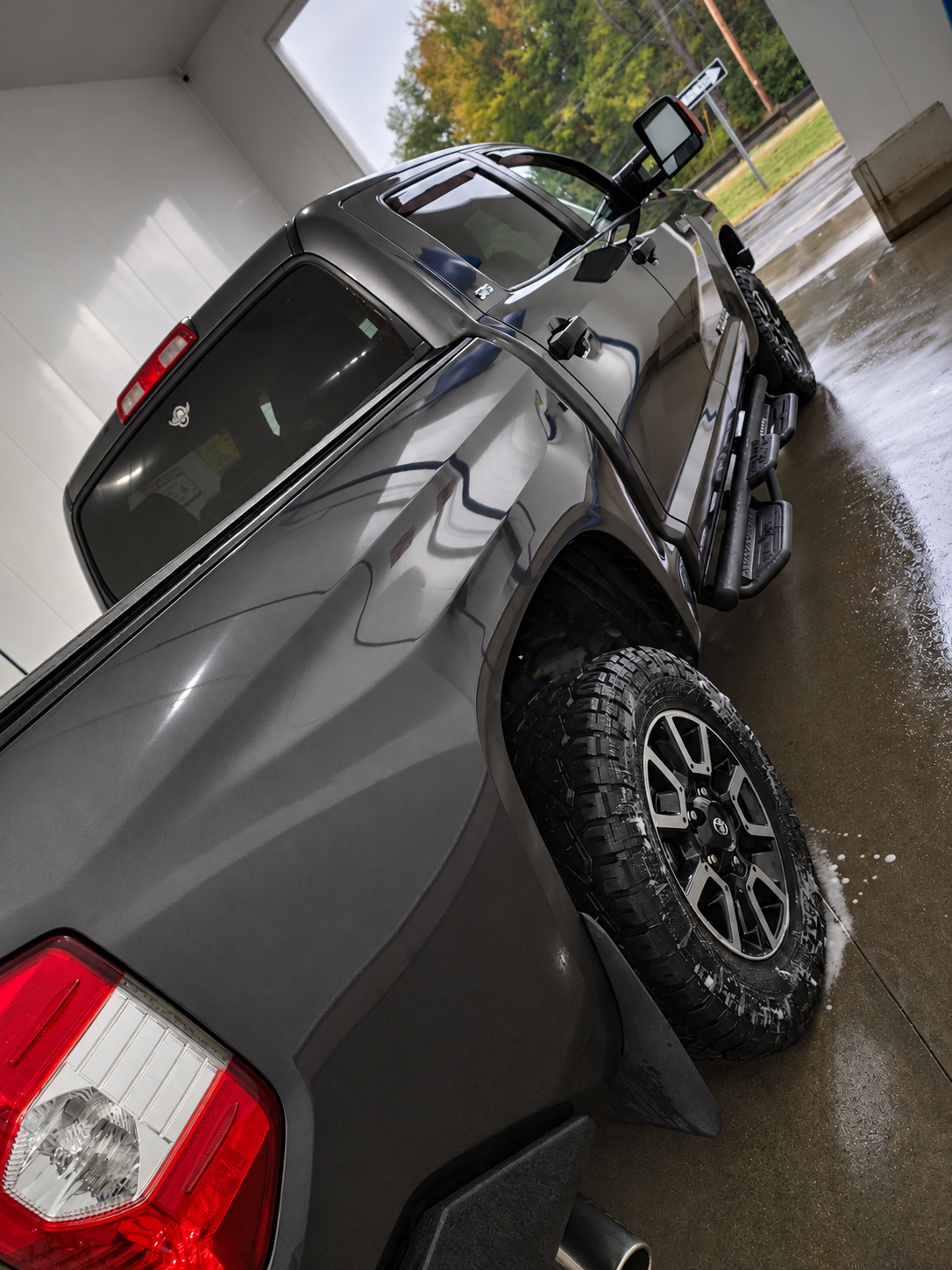 Glossy rear quarter panel and wheel on a detailed Tundra