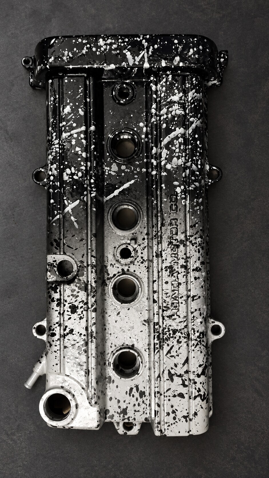 Front view of a custom splatter-painted valve cover