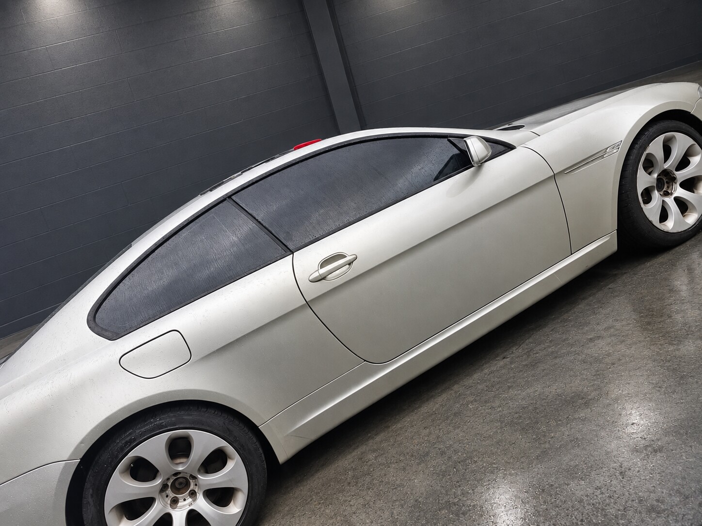 Finished tinted windows on a silver BMW coupe