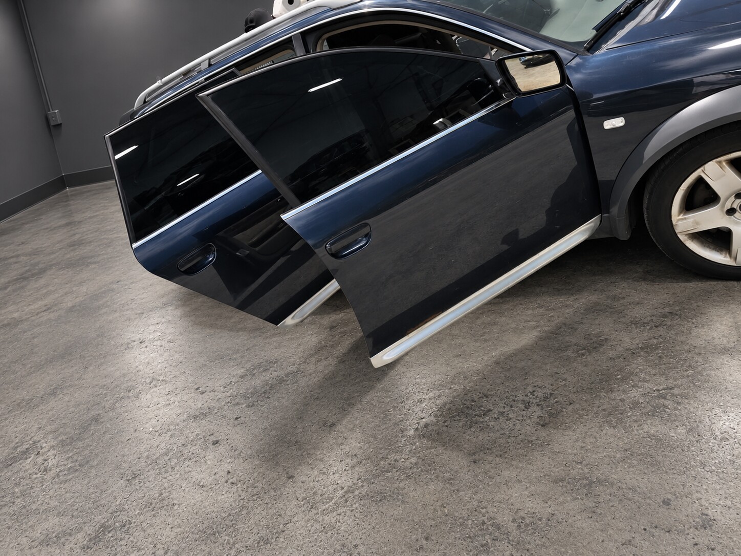 Dark tinted side windows with the doors open