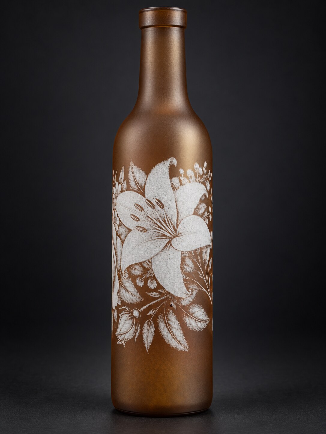 Lily floral artwork laser engraved on a frosted glass bottle
