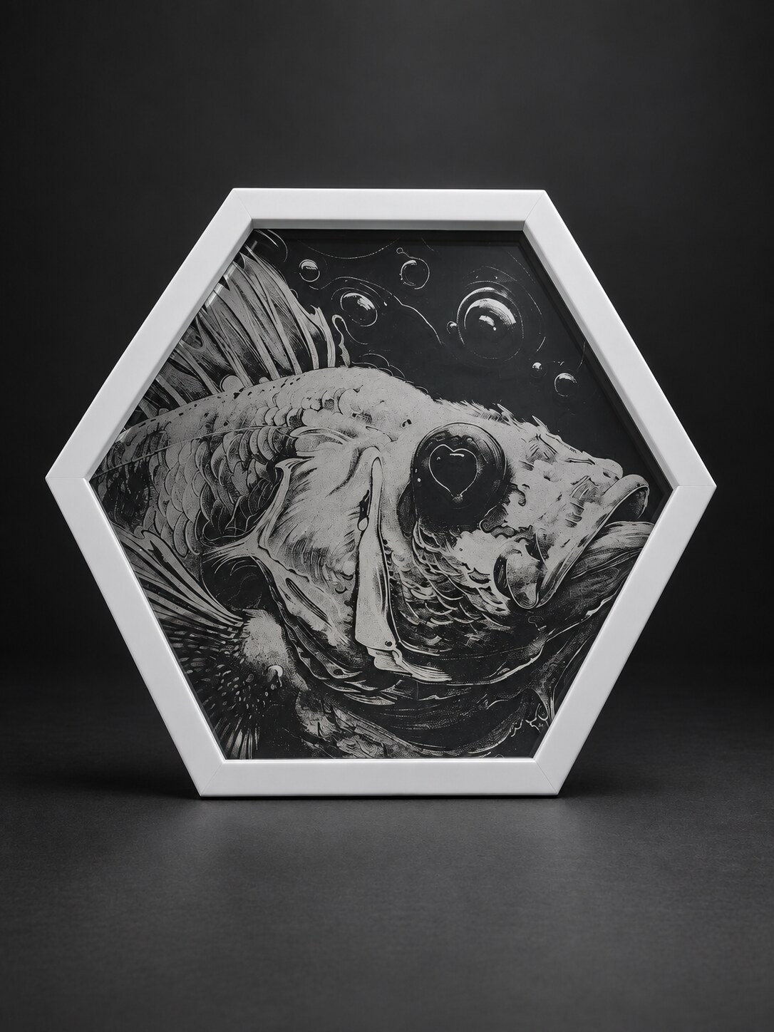 Detailed fish artwork displayed in a coffin-shaped glass frame